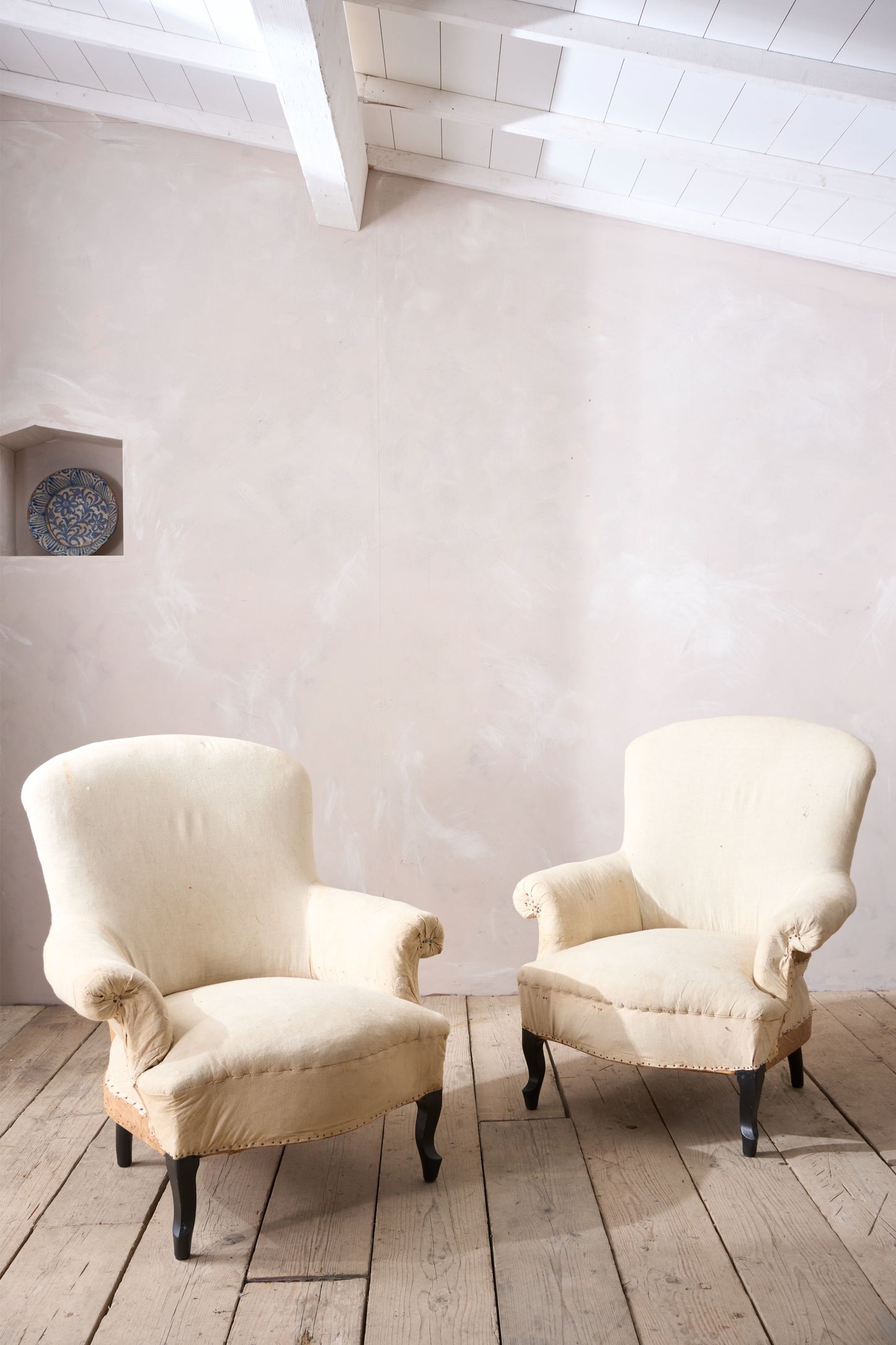 Pair of Napoleon III Wide armed plain curved back armchairs