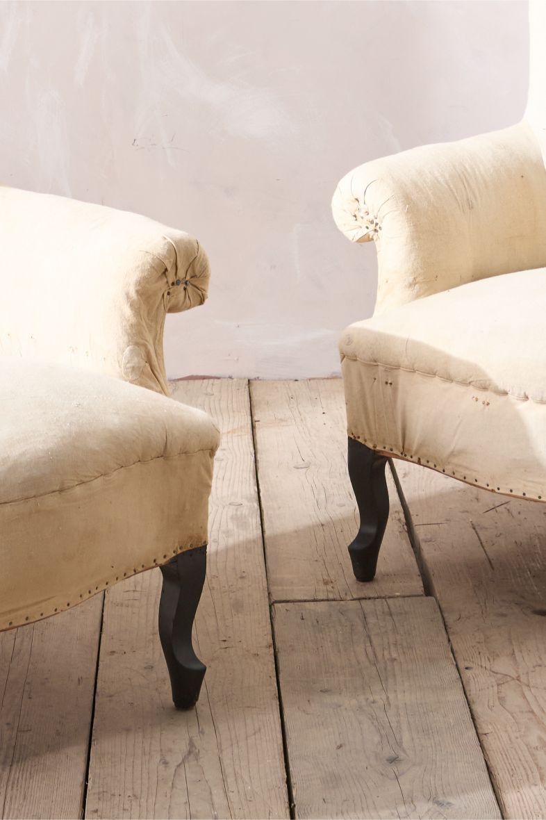 Pair of Napoleon III Wide armed plain curved back armchairs