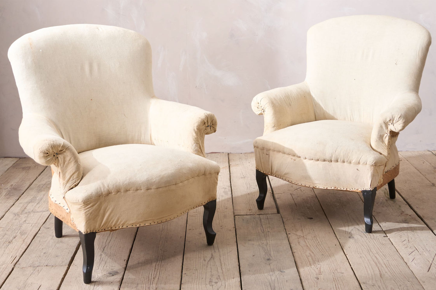 Pair of Napoleon III Wide armed plain curved back armchairs