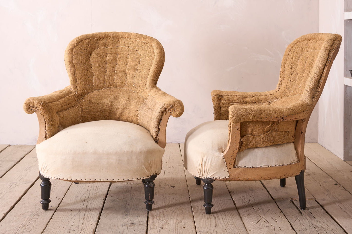 Pair of hessian curved back Napoleon III armchairs