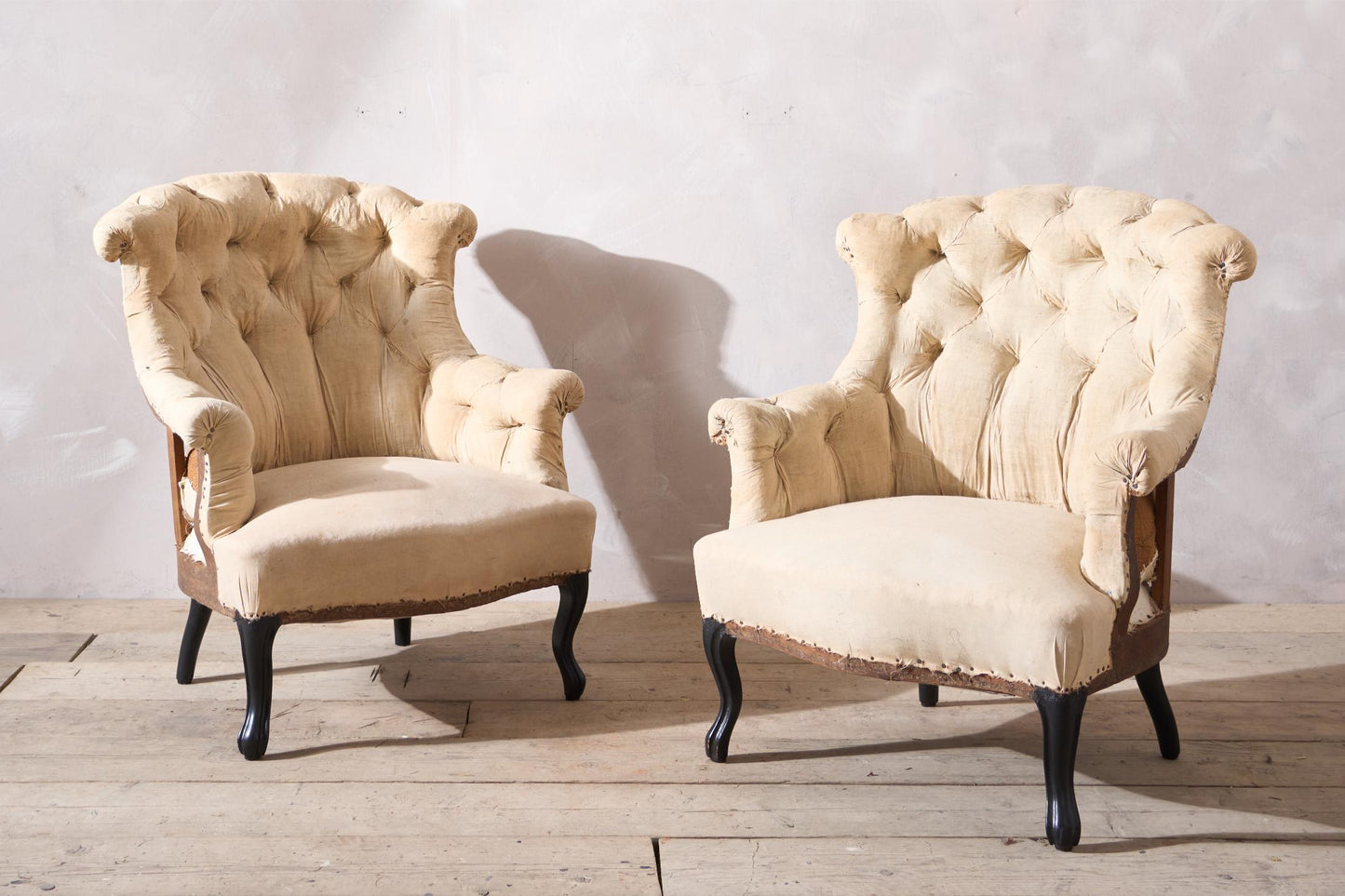 Pair of Napoleon III buttoned fishtail armchairs