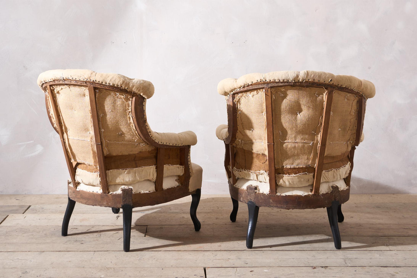 Pair of Napoleon III buttoned fishtail armchairs