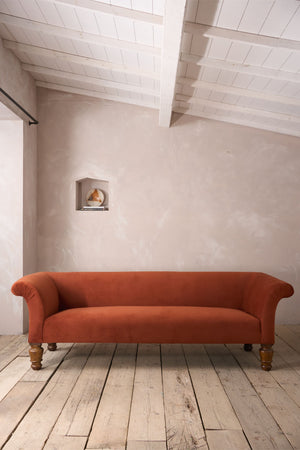 Victorian country house sofa in rust velvet
