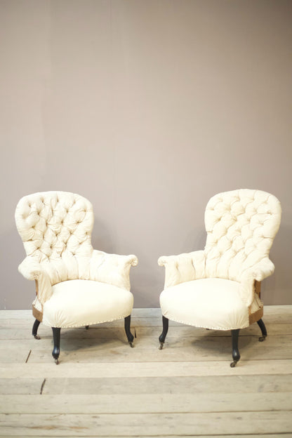 Pair of Napoleon III buttoned spoon back armchairs