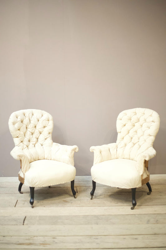 Pair of Napoleon III buttoned spoon back armchairs