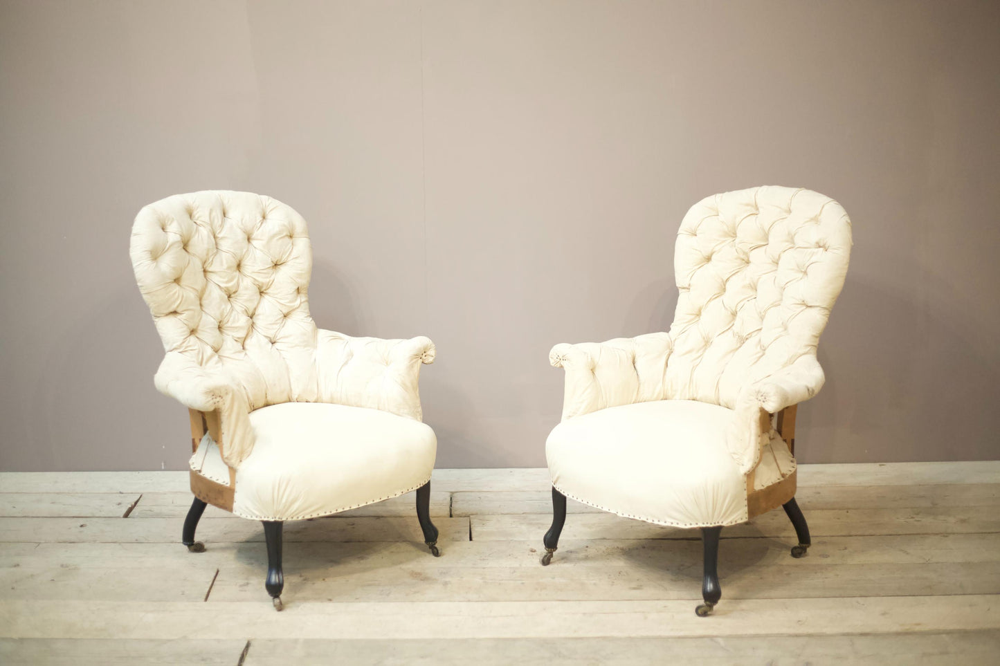 Pair of Napoleon III buttoned spoon back armchairs