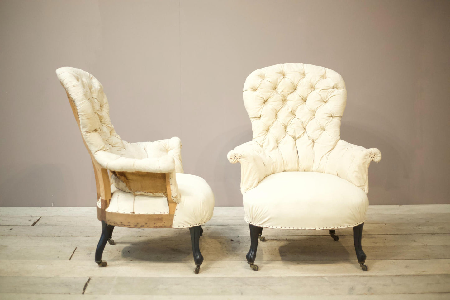 Pair of Napoleon III buttoned spoon back armchairs